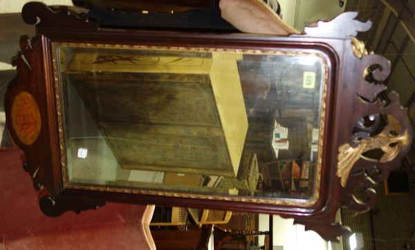 An early 19th century mahogany fret cut wall mirror with gilt ho ho bird surmount, 50.5 cm wide.