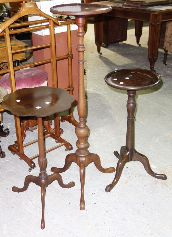 A 19th century mahogany jardinière stand and two mahogany wine tables. (3)