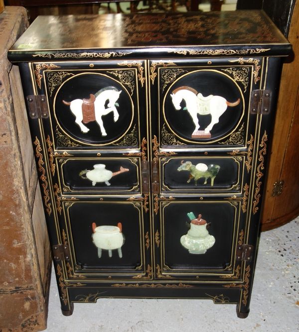 A 20th century Chinese black lacquered side cabinet, 60.5cm wide.