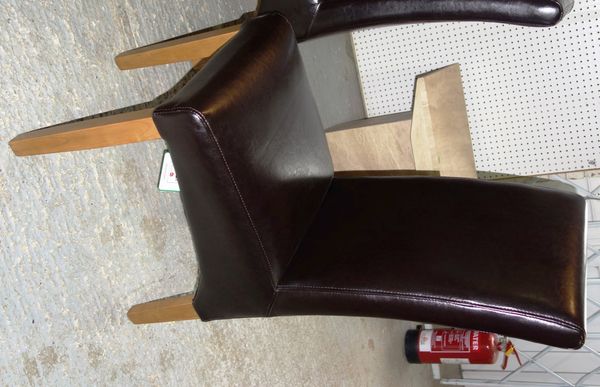 A set of six 20th century brown leather upholstered chairs. (6)