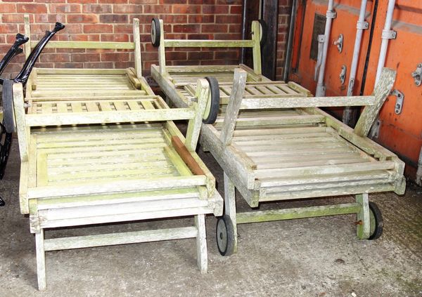 A set of four 20th century teak sun loungers. (4)