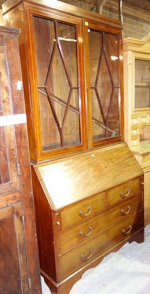 A 19th century inlaid mahogany bureau bookcase.