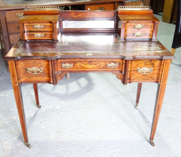 A 19th century rosewood and inlaid lady's writing desk with gilt tooled leather top.