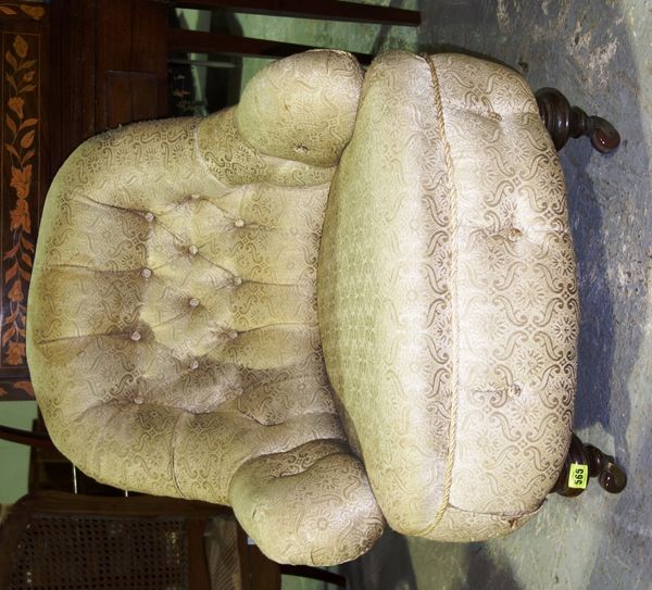 A 19th century walnut framed button back nursing chair.