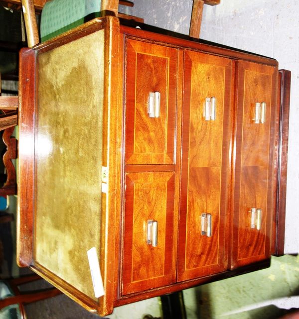 A 20th century continental mahogany small chest of two short and two long drawers.