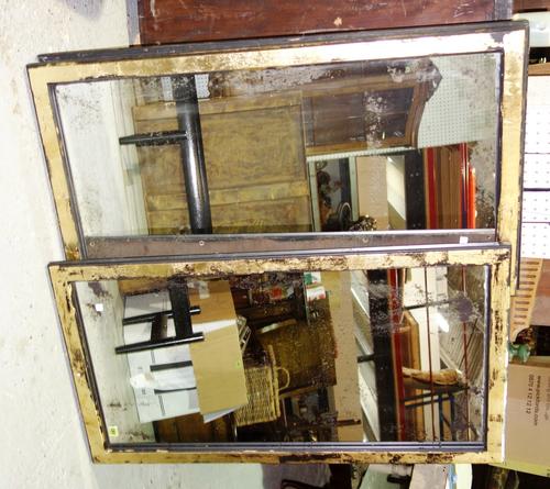 A pair of 20th century ebonised and gilt rectangular wall mirrors. (2)