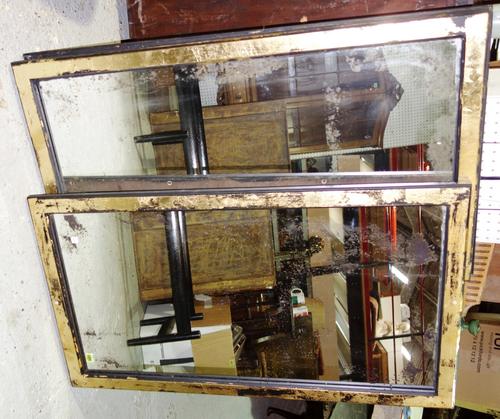 An ebonised and gilt rectangular mirror and an ebonised rectangular frame. (2)