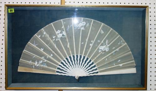A framed and glazed Oriental fan, 79cm wide including frame.