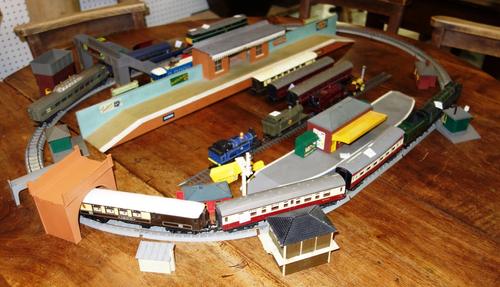 A collection of OO gauge Triang including trains, stock, rails and buildings, together with a box of Airfix models. (qty)