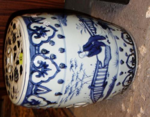A large blue and white Oriental garden seat.