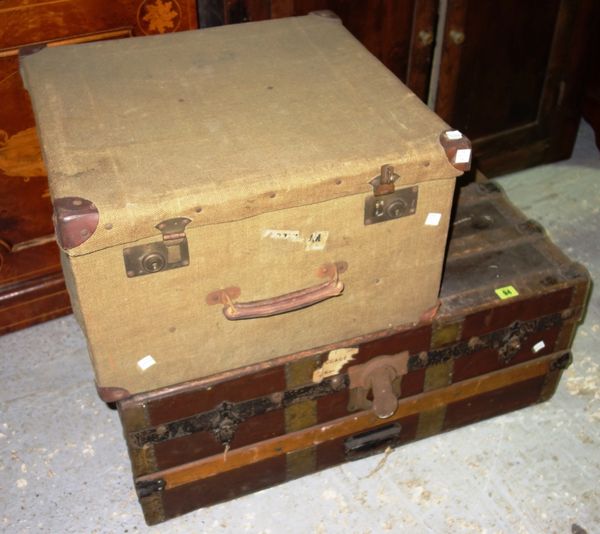 An early 20th century green canvas trunk and a leather and wood bound trunk. (2)