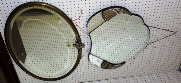 A oval brass framed wall mirror with cherub surmount and a 20th century Art Deco style mirror with chrome decoration. (2)