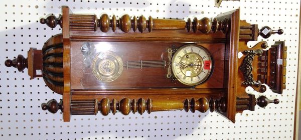 A 19th century walnut cased eight day wall clock.