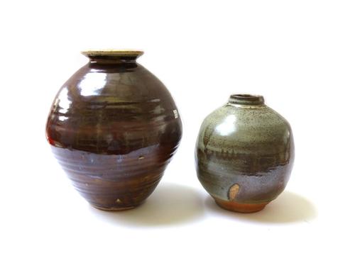A David Leach stoneware vase of globular form, decorated in greys and browns with an opposing stylised leaf design, with impressed marks, 24cm high, a