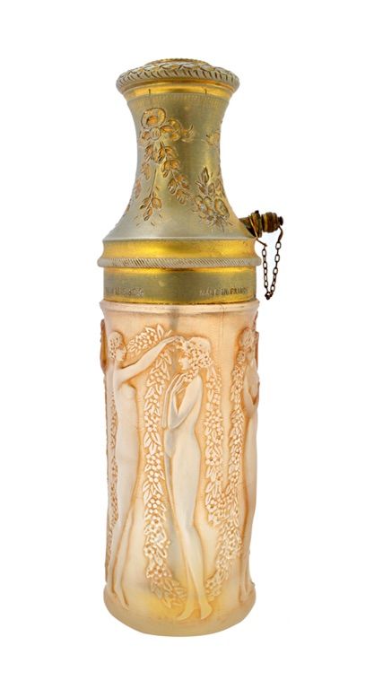 A Lalique glass and metal mounted 'Le Parisien' atomiser for Molinard, circa 1923, the glass decorated in the 'Figurines et Guirlandes' pattern, with