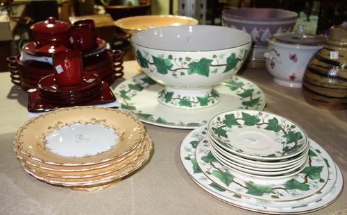 A quantity of ceramics, including a Wedgwood Napoleon Ivy punch bowl, a 20th century red ceramic part dinner service and sundry. (qty)