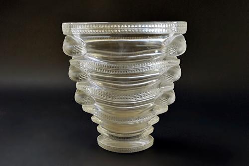 A Lalique 'Saint Marc' clear and frosted glass vase, designed in 1939, moulded with birds against a tapering oval ground, 17cm high.   Illustrated