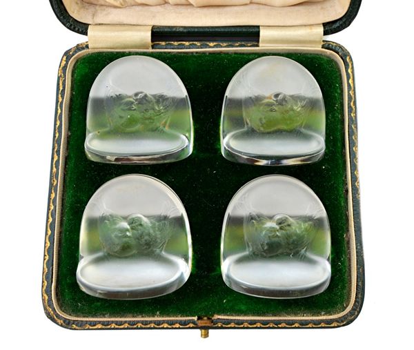 A set of four Lalique 'Pinsons' clear and frosted glass menu holders, designed in 1924, relief moulded with chattering birds, signed to the base 'R La