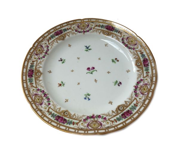 A Nast, Paris, porcelain part dinner service, 19th century, each piece painted with scattered flower sprigs inside a floral border and gilt rim, compr