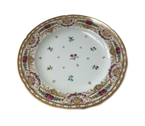 A Nast, Paris, porcelain part dinner service, 19th century, each piece painted with scattered flower sprigs inside a floral border and gilt rim, compr