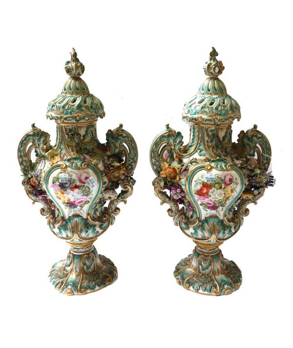 A large pair of English porcelain vases and covers, probably Minton or Coalport, circa 1830, each encrusted with flowers in high relief and painted ea