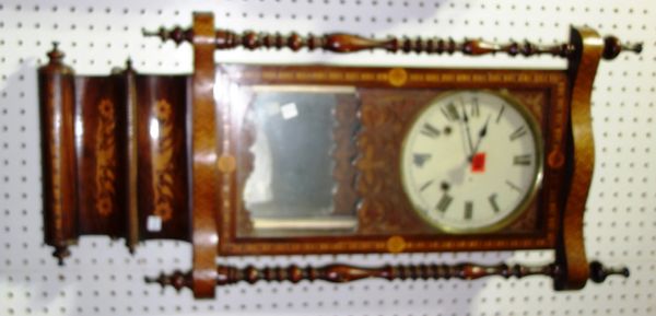 A 19th century rosewood and inlaid eight day wall clock.