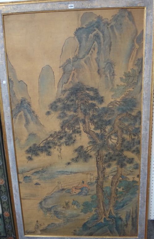 A large Chinese painting of a scholar in an extensive landscape, 18th/19th century, watercolour on silk laid on board, seated beneath a pine tree with
