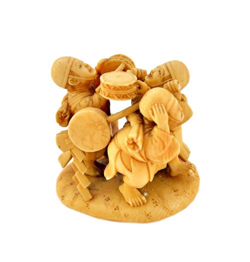 A Japanese ivory group of three musicians, Meiji period, each carved standing with musical instruments on an oval base, signed, (a.f), 4.5cm.high.  Il