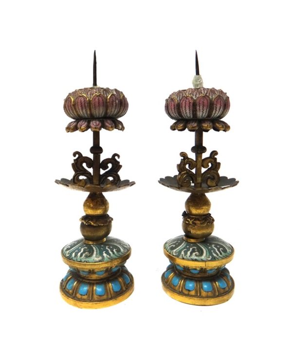 A pair of Chinese gilt-metal and enamel pricket candlesticks, circa 1900, each with a cloisonné and turquoise enamelled base beneath a gilt-metal colu