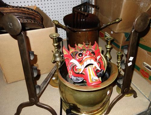 A quantity of copper, brass and other metalwares, including a helmet shaped coal scuttle, candlesticks, fire dogs and sundry. (qty)