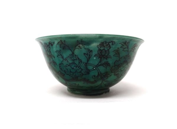 A Chinese porcelain green ground bowl, blue painted six character Chenghua mark but later, the sides `pencilled' in black with a continuous band of pe
