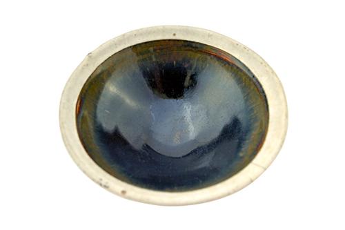 A Chinese pottery white-rimmed bowl, Song Dynasty, probably Cizhou kilns, with `hare's fur' glaze beneath a rim with white slip under a clear glaze, S