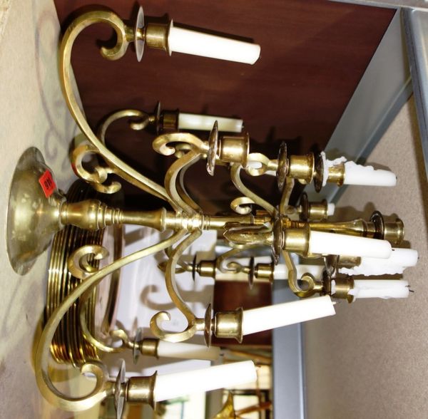 A gilt brass seventeen branch candelabra, together with a quantity of brass flatware and brass dinner plates. (qty)