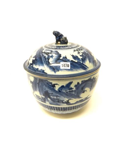 A good Arita large blue and white circular bowl and cover, Edo period, circa 1700, the domed cover set with a Buddhist lion finial, the body painted w