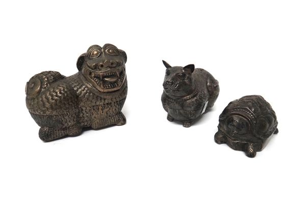 Three South East Asian white metal boxes and covers in the form of a cat, a lion dog and a turtle, the largest 13cm. diameter; and a group of four Can