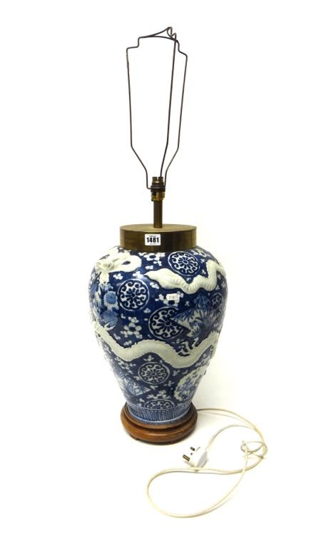 A blue and white ovoid vase, circa 1900, moulded with two white dragons against a prunus and `cracked-ice' ground, adapted as a lamp, (a.f), vase 41cm