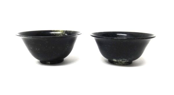 A pair of Chinese hardstone bowls, with green and cream flecking, (a.f),  10cm, diameter.