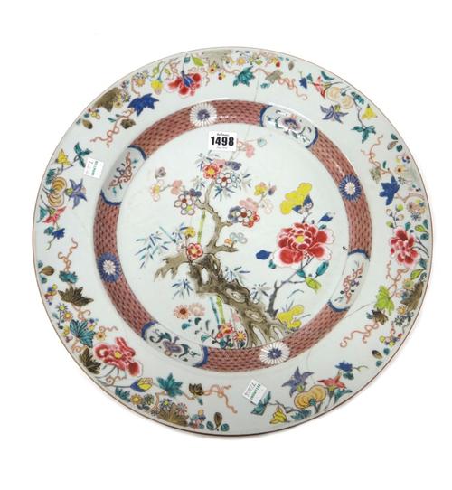 A Chinese famille-rose charger, Yongzheng/early Qianlong, painted with  flowering  prunus, peony and bamboo, (a.f), 39cm.diameter.