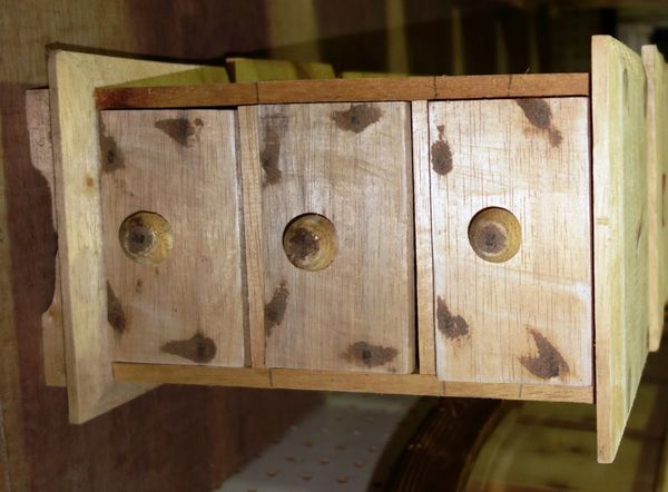 A group of eight softwood three drawer table top chests. (8)