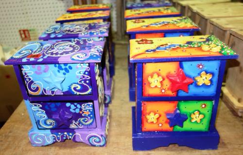 A group of eight hand painted two drawer wooden table top chests in various colours. (8)