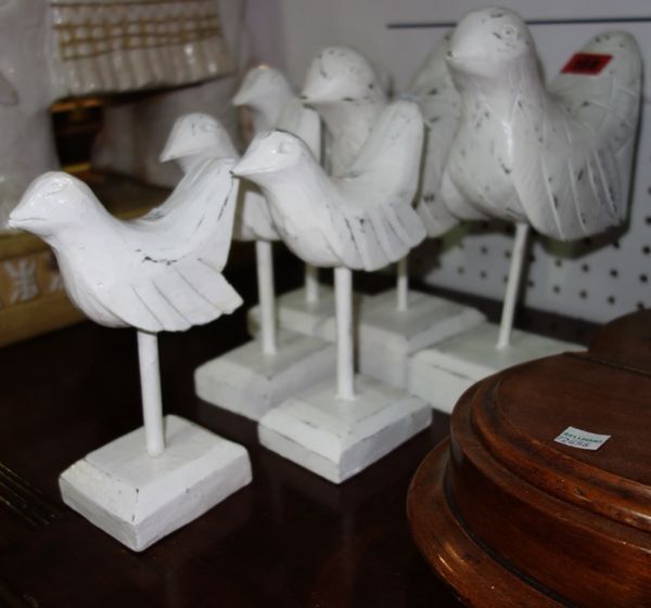 A group of twelve white painted wooden doves in various sizes. (12)