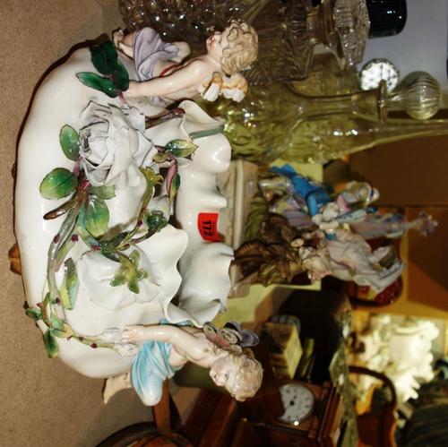 A group of Continental porcelain figures, and a floral moulded jardinière. (qty)