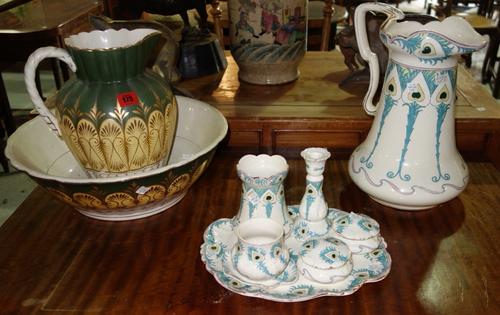 A Victorian green and gilt decorated pottery wash bowl and jug, and a pottery dressing table set in an Art Nouveau design, (qty)