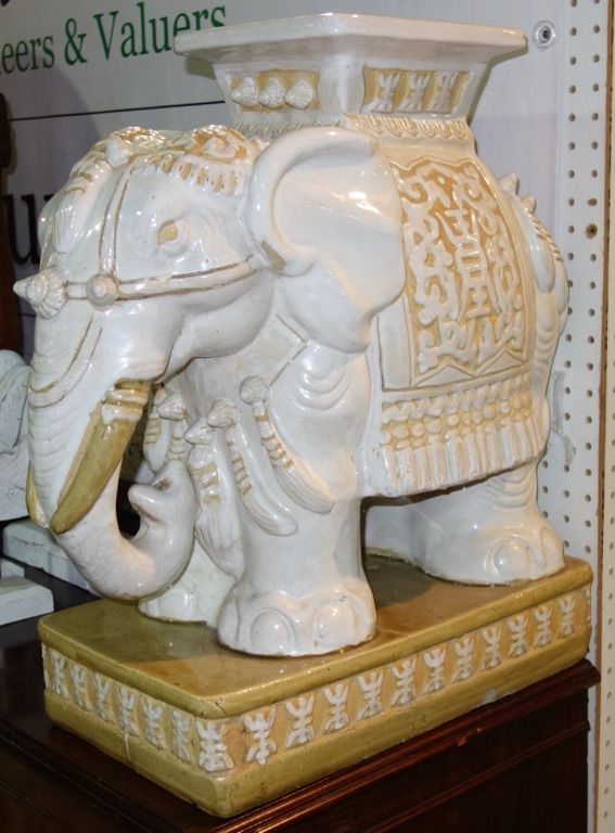 A pair of Oriental garden seats formed as elephants. 44cm x 57cm. (2)