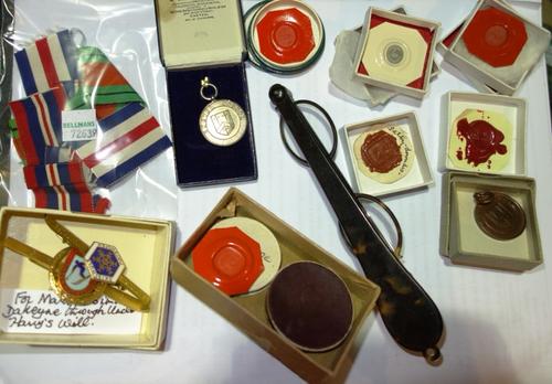 A quantity of collectables including lorgnettes, medallions, fob relating to Exeter School, Rotary club medal and sundry.