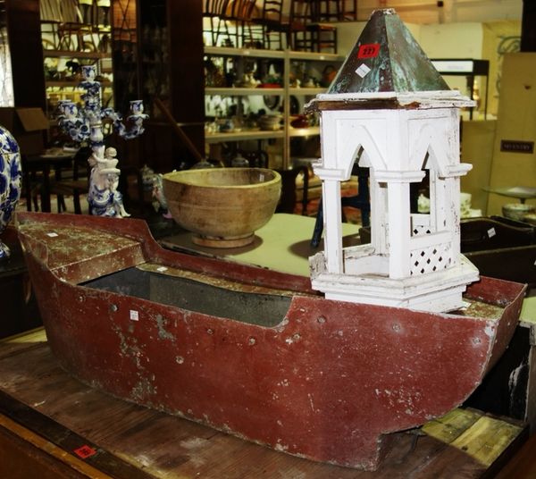 A red painted metal model of a boat, and a white painted pagoda. (2)
