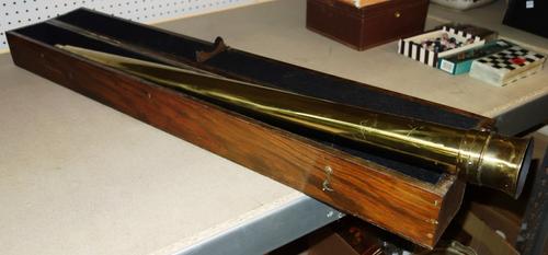 A 20th century brass cased telescope in an oak box together with a painted terracotta bust of a female (2).