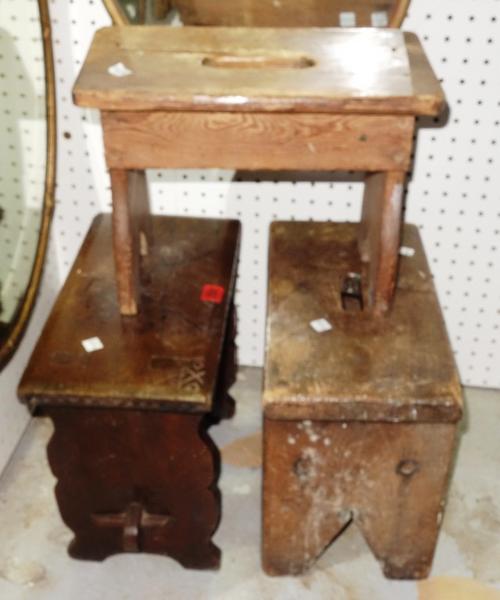 Two stained pine trestle type stools and one oak trestle stool, each approx 39cm, (3).