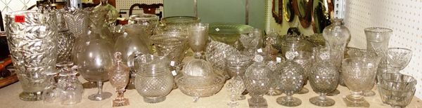 A large group of 19th century and later cut glass, including beakers etched with thistles, decanters, a ewer, bowls, drinking glasses and sundry. (qty