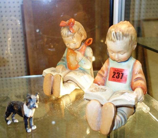 A pair of Hummel pottery bookends modelled as children reading, together with two Beswick models of bull terriers, a Copenhagen bull terrier and a pai